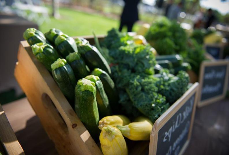 broccoli and zucchini displayed in wooden box