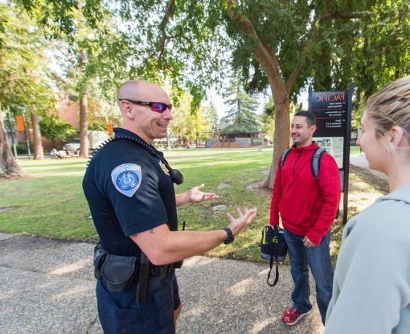 Officer speaking to students